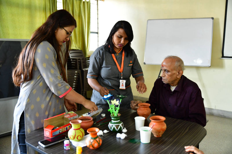 Care staff and Psychologists engaging persons with Dementia at one of NMT's Day Care Centres