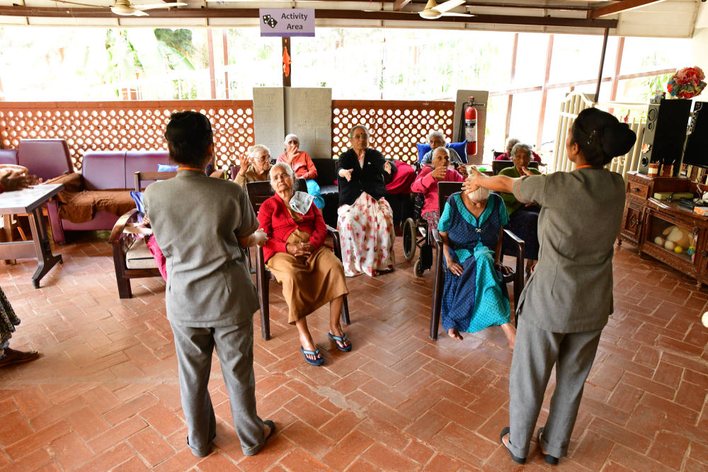 Residents engaged in activities in the covered activity area at NMT's Kothanur Centre