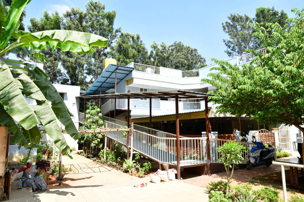 A view of the building equipped with a ramp and covered activity area